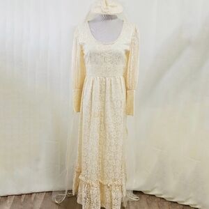 Vintage 1970s cream lace wedding dress with long veil fascinator mutton sleeves